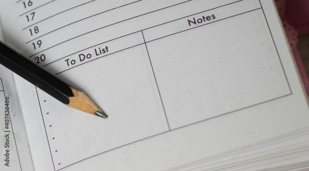 Pencil on opened diary notebook. Empty To do list and Notes. Close-up. Pencil on opened diary notebook. Empty To do list and Notes. Close-up.