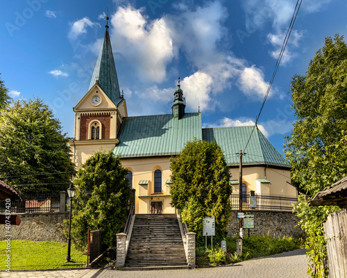 Fototapeta Naklejka Na Ścianę i Meble -  St. John Baptist parish church in historic royal open-air museum town of Lanckorona in mountain region of Lesser Poland