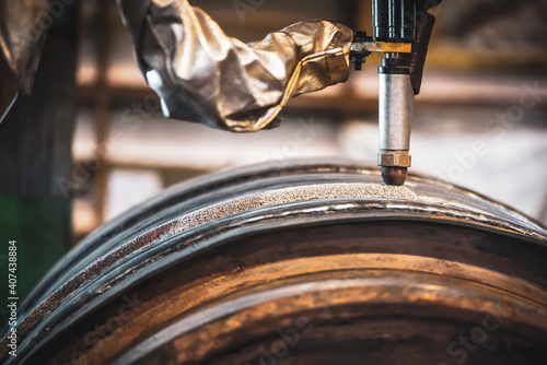 Automatic Submerged Arc Welding (SAW), Industrial automatic welding by submerged arc welding process continuously with carbon steel material in the factory.