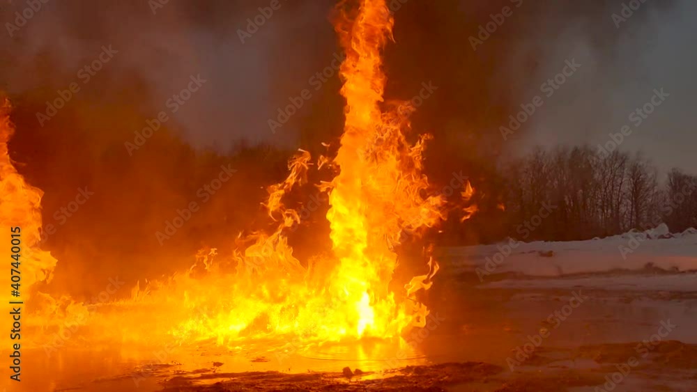 Time Lapse of multiple fire tornado's caused from a burning oil spill on the ground. Time Lapse of multiple fire tornado's caused from a burning oil spill on the ground.