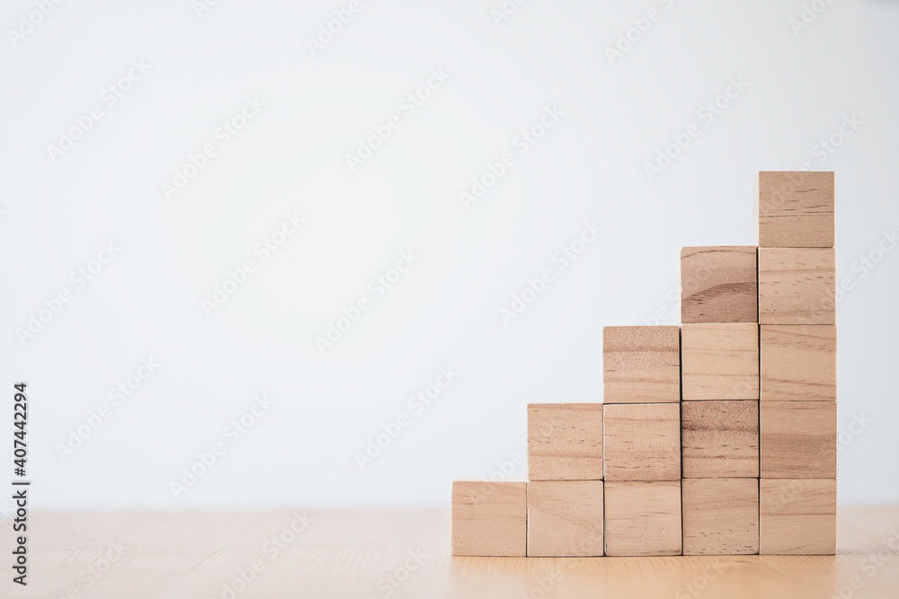 stacking of blank wooden cubes on table with copy space for input wording and infographic icon.