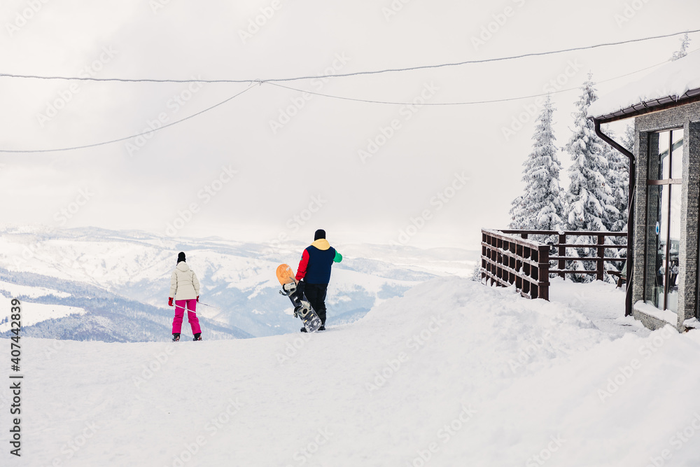 People on the slopes who go skiing and snowboarding People on the slopes who go skiing and snowboarding
