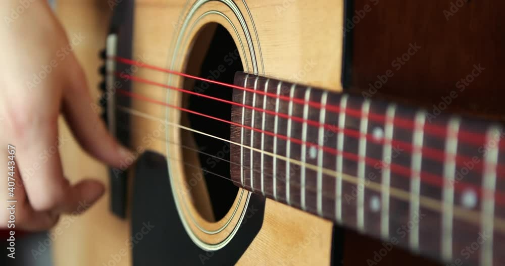 Strumming a guitar close up in super slow motion 300fps Strumming a guitar close up in super slow motion 300fps