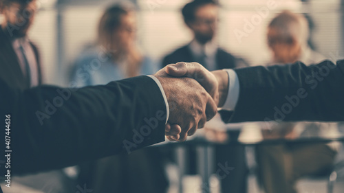 close up. business partners shaking hands during a business meeting