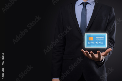Fototapeta Naklejka Na Ścianę i Meble -  Business man in suit hand holding blank credit card icon showing for concept banking and finance service