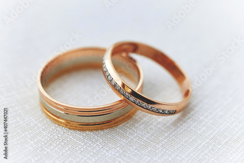 gold wedding rings on a white fabric surface. preparing for the wedding. close-up, macro