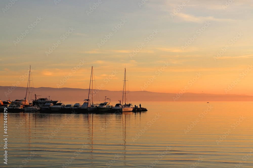 Small boat in the pier and beautiful sunset. Landscape in Split, Croatia. 