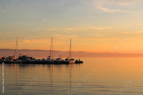 Fototapeta Naklejka Na Ścianę i Meble -  Small boat in the pier and beautiful sunset. Landscape in Split, Croatia. 