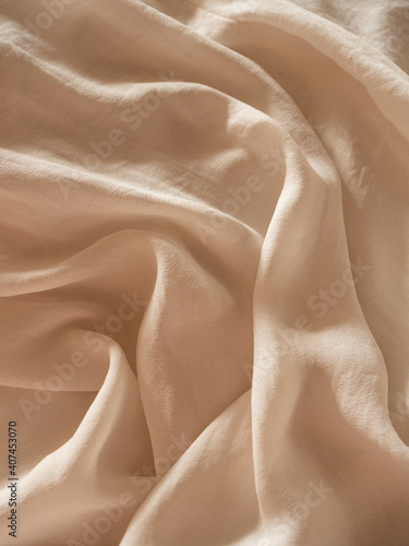 Delicate flowing milky silk with a string of baroque pearls in the morning light