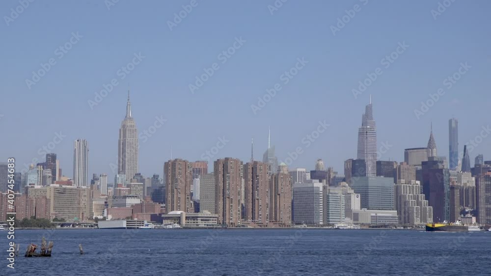 Midtown Manhattan in New York City from across the East River in Williamsburg, Brooklyn. Tilt Down. Midtown Manhattan in New York City from across the East River in Williamsburg, Brooklyn. Tilt Down.