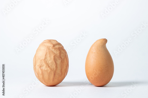 Deformed chicken eggs. Chicken eggs on a white background.