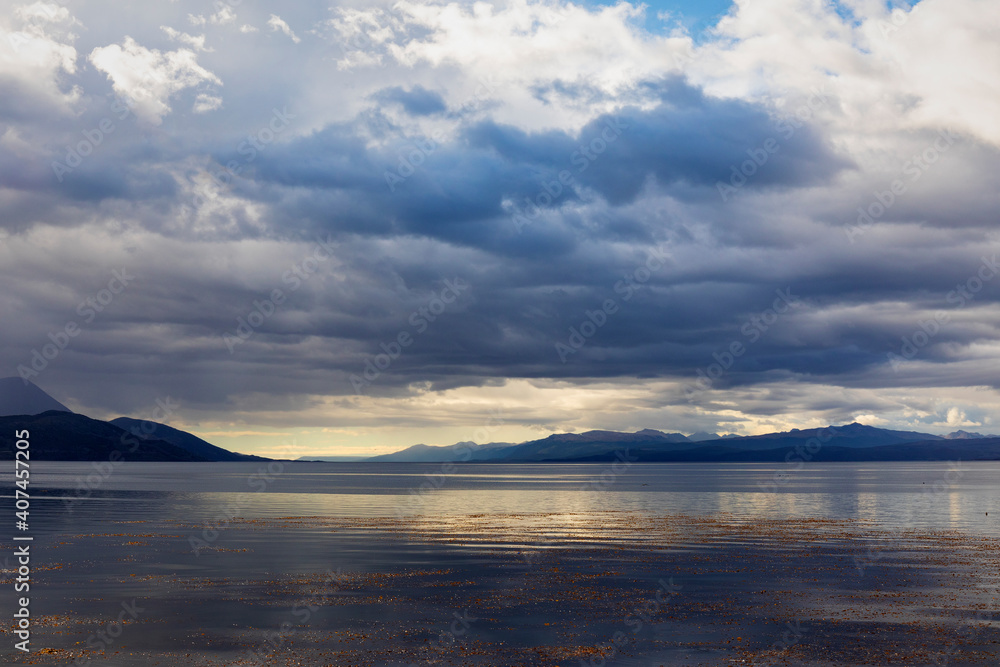 View over the Beagle Channel from Ushuaia towards the Chilean Coast. The sky look menacing and a storm is coming in. View over the Beagle Channel from Ushuaia towards the Chilean Coast. The sky look menacing and a storm is coming in.