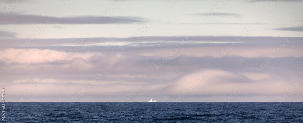 First iceberg seen with an interesting cloud formation above it while crossing the infamous Drake Passage on the way to the Antarctic Peninsula.