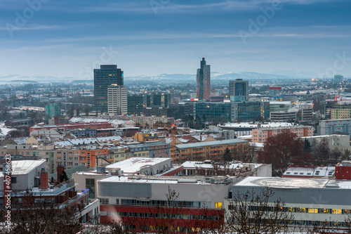 Panoramic view of Brno in Czech Republic. There is a hospital with heliport in the foreground. In the middle there are two towers of Spielberk office centre and AZ tower and M-Palace.