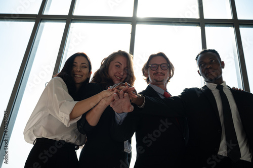 Group of diversity business people hands stack together at the office.