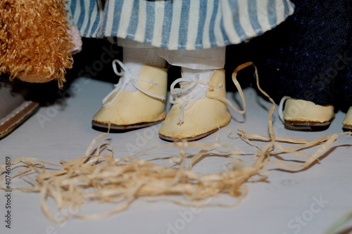 Wallpaper Mural Doll's legs in beige shoes, on a light background. Torontodigital.ca