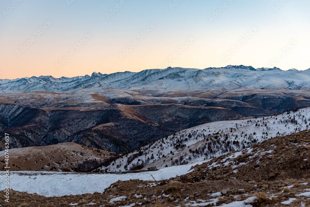 Winter mountain peaks at sunset
