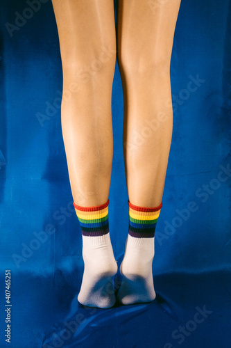 Woman with LGTB socks with blue background