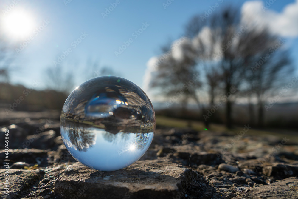 landscape seen through a gals ball. In the background the steam from a cooling tower landscape seen through a gals ball. In the background the steam from a cooling tower