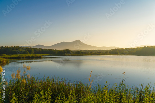 The sunrise in the morning with mountain, lake and sky at Mae Moh, Lampang, Thailand.