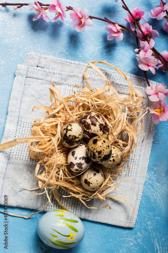 quail eggs inside nest in a easter background