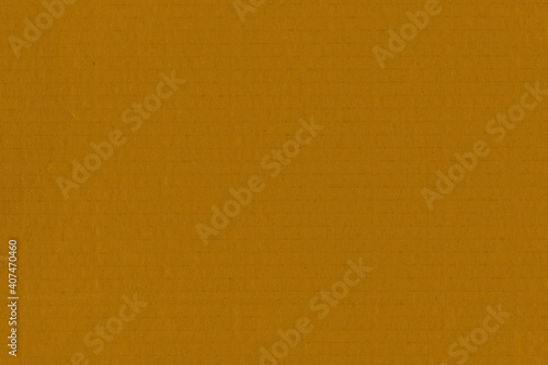 Clean yellow retro paper background. Vintage cardboard texture. Grunge paper for drawing. Simple blank fabric pattern.