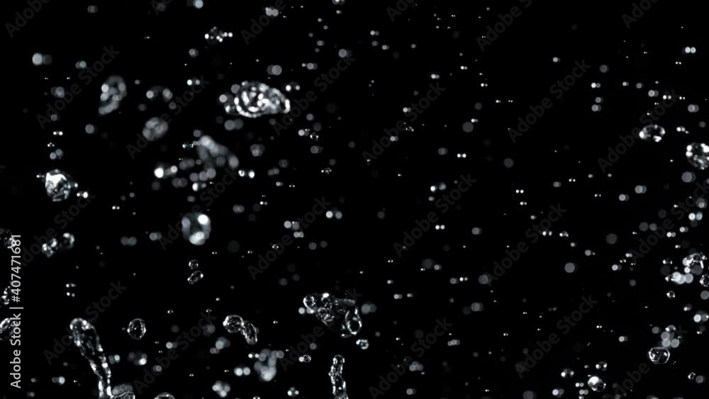 Super Slow Motion Shot of Water Splash Isolated on Black Background at 1000fps. Super Slow Motion Shot of Water Splash Isolated on Black Background at 1000fps.