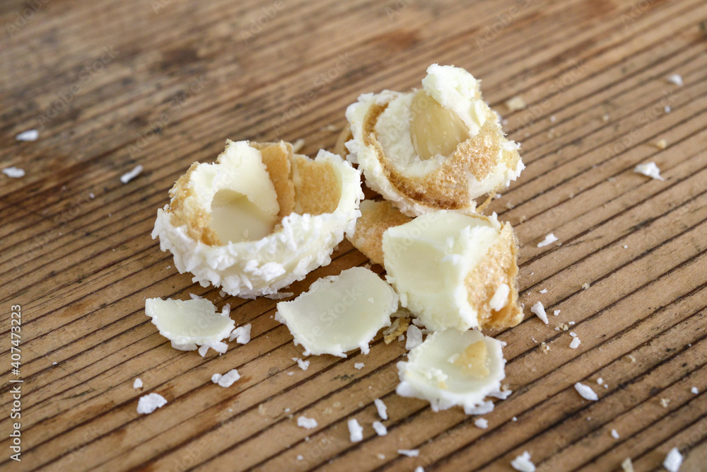 White Chocolate and Coconut Truffles on old wood background White Chocolate and Coconut Truffles on old wood background