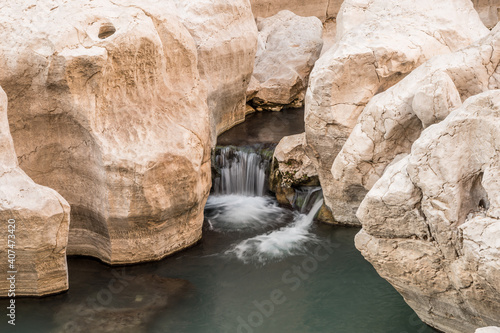 Small cascade waterfall at wadi bani khalid natural pools, Oman Sultanate