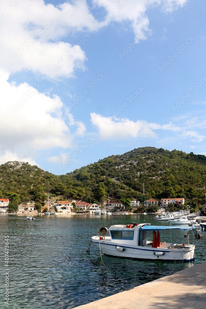 Small fishing boat in the picturesque bay on island Lastovo, Croatia. Small fishing boat in the picturesque bay on island Lastovo, Croatia.