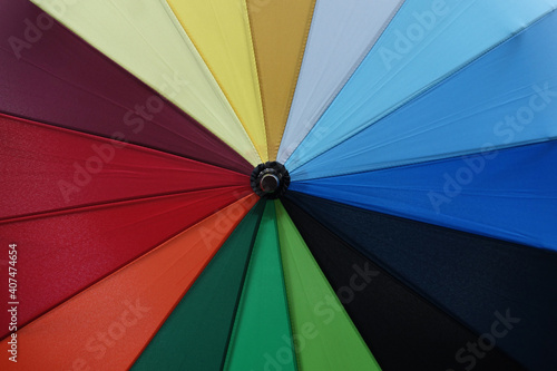 Bright fabric umbrella background with alternating color pattern