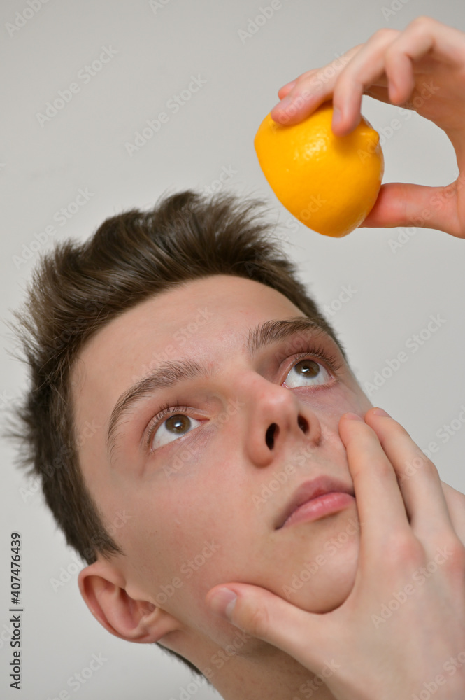 Man Putting Lemon Fruits Drops In His Eye