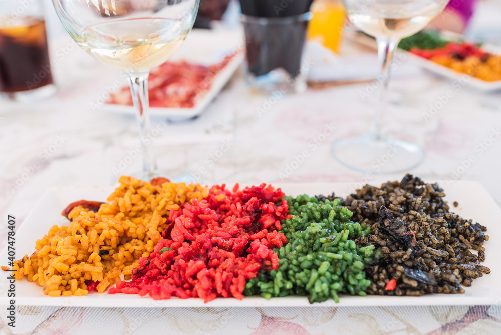 Tasting plate with various types of typical Valencian rice paellas