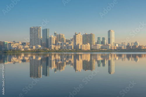 The skyline with reflection in Xiamen, China, at sunrise.