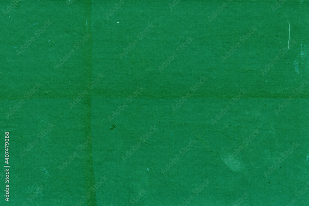 Fototapeta premium Cardboard green abstract pattern texture close-up. Retro old paper background. Grunge concrete wall. Vintage blank wallpaper.