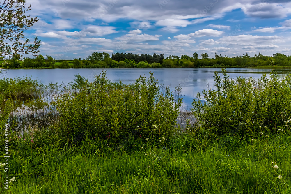 A view across the expanse of Cropston Reservoir in Leicestershire in summertime
