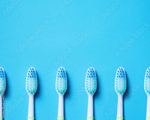 blue toothbrushes on blue background
