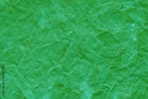 Cardboard green abstract pattern texture close-up. Retro old paper background. Grunge concrete wall. Vintage blank wallpaper. © artistmef