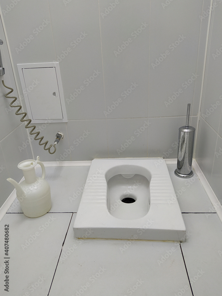 muslim toilet without toilet. Islamic dressing etiquette. Dressing room in  an Islamic country. Stock Photo | Adobe Stock