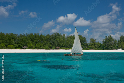 Traditional sailing boat dhow on the coasts of Zanzibar Islands.