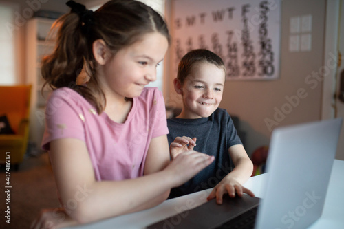 boy and girl using the computer