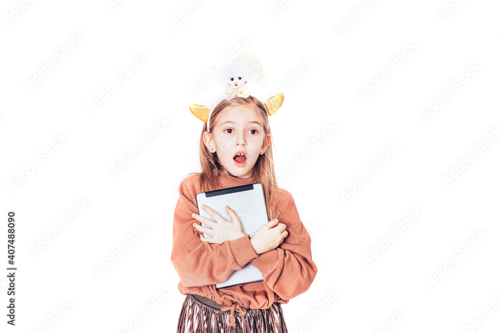 Child holding a tablet in his hands. Distance learning of children. Modern technologies in school education Child holding a tablet in his hands. Distance learning of children. Modern technologies in school education