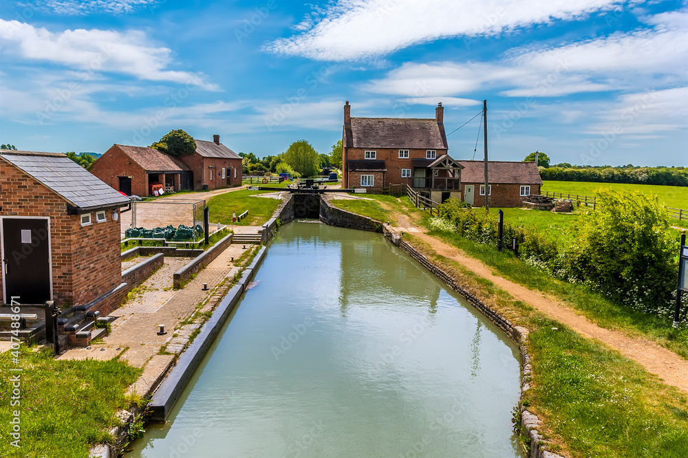 A view towards a flight of locks on the Oxford Canal at Napton, Warwickshire in summertime A view towards a flight of locks on the Oxford Canal at Napton, Warwickshire in summertime