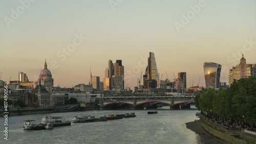 Time lapse. View down River Thames to London skyline with St Paul's, The Shard, Walkie Talkie building and Oxo Tower, London, United Kingdom photo