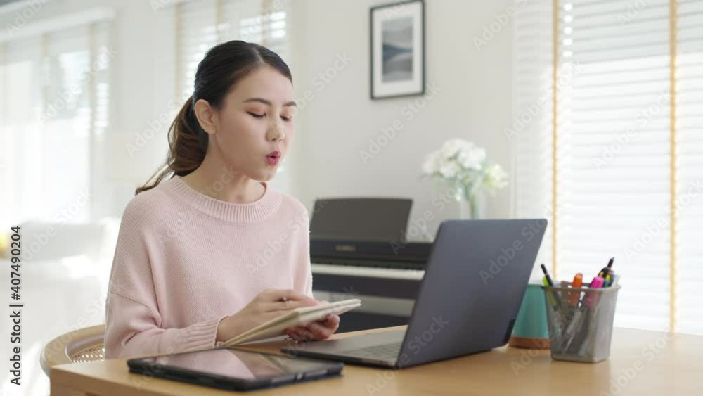 Young asian woman employee work from home using computer notebook videocall meeting conference angry annoy with low poor unreliable internet wifi connection problem issue outage. Young asian woman employee work from home using computer notebook videocall meeting conference angry annoy with low poor unreliable internet wifi connection problem issue outage.