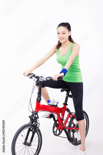 Young woman riding a bicycle