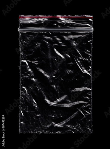 Small Crumpled Plastic Zip Bag Ziplock Lock Zipper Isolated On Black. Grunge Overlay Texture.