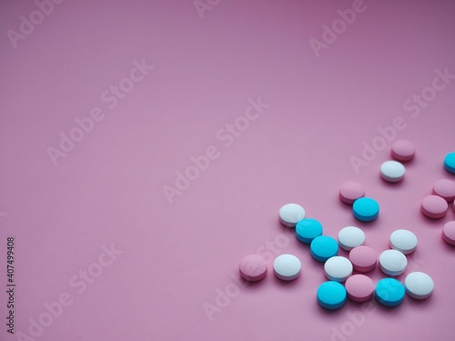 Vitamins, pills and tablets on pink background. Pharmaceutical products. Healthcare. Drug prescription for the treatment of a drug. Pharmacy theme. Copy space