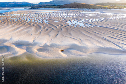 The coast between Kiltoorish bay beach and the Sheskinmore bay between Ardara and Portnoo in Donegal - Ireland photo