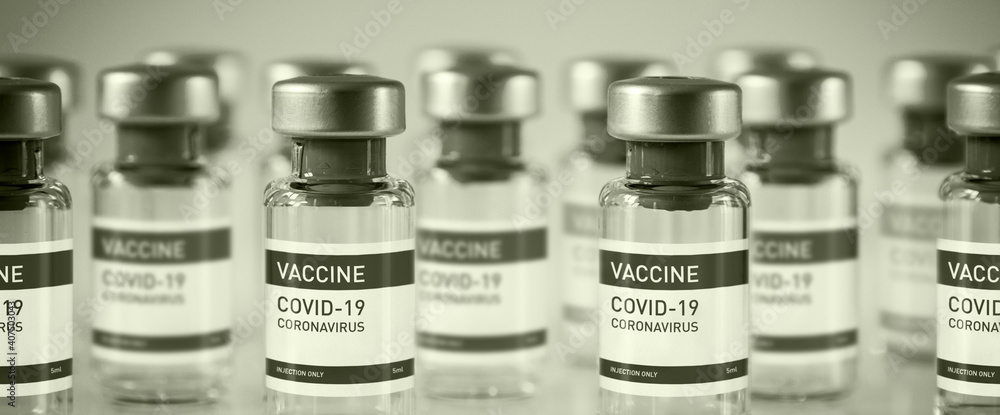 Covid-19 vaccine bottles on a black and white background Covid-19 vaccine bottles on a black and white background